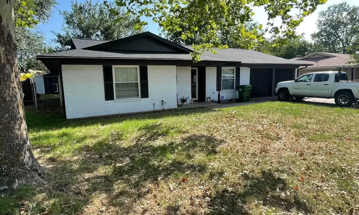 Professional roofing crew working on a residential roof in Stuttgart